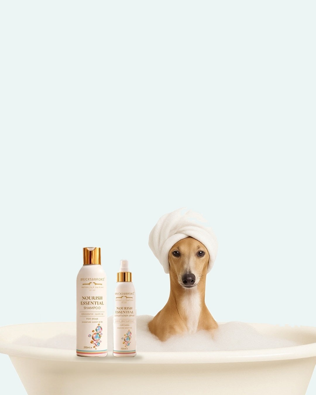 Hond met handdoek in bad, met de Bricks&Broks shampoo en conditionerspray